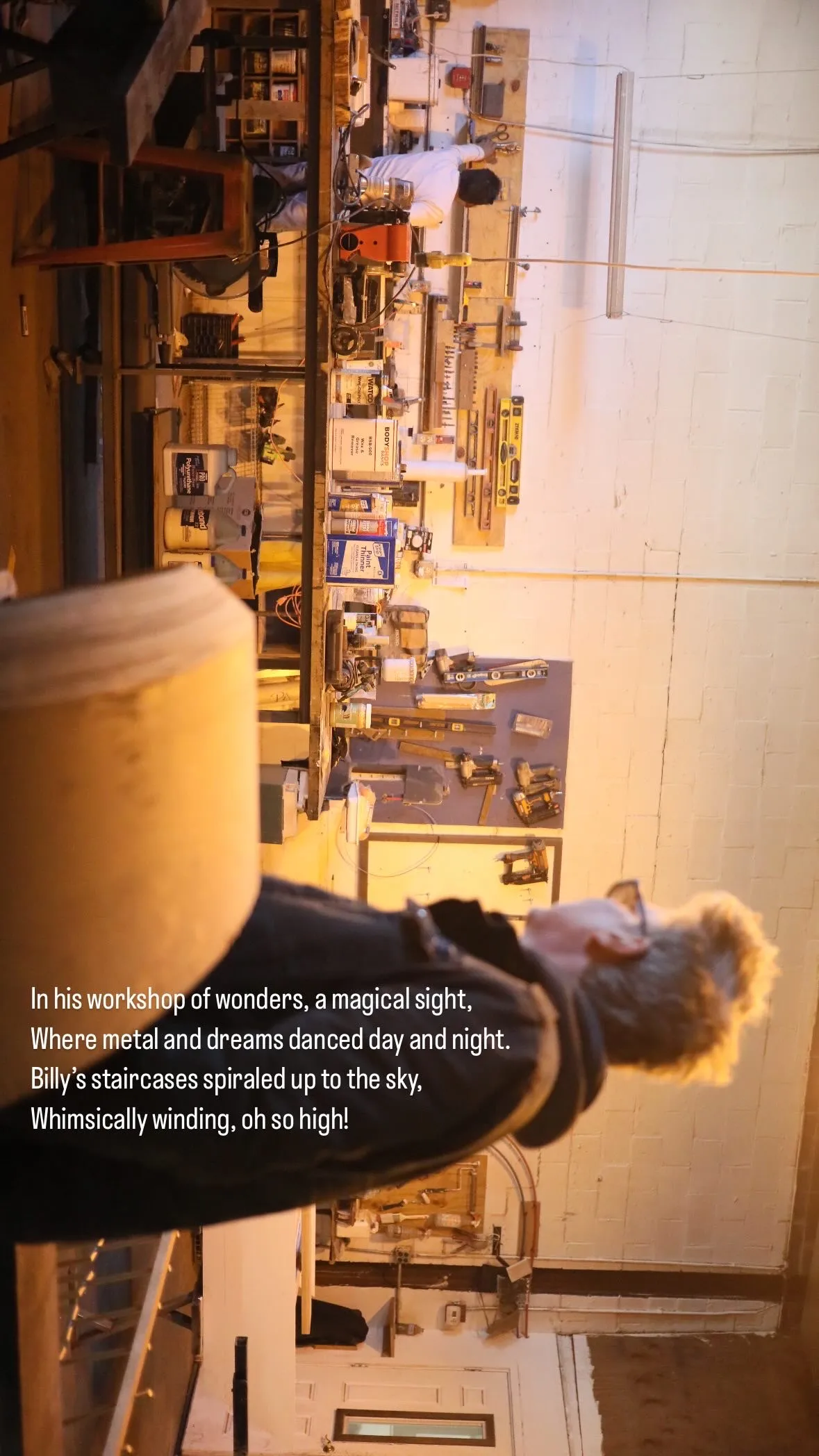 Person in a workshop filled with tools and equipment, looking toward a workbench with various materials and tools on the wall.